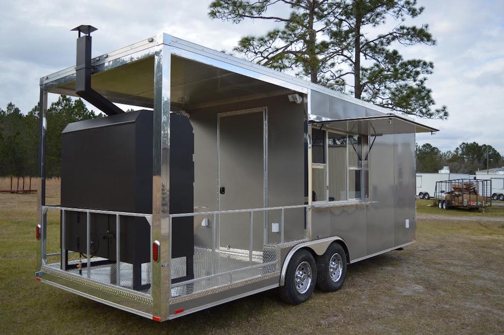 A large trailer with a grill on the back.