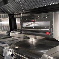 A kitchen with many different types of appliances.