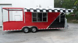 A red and black trailer parked in the street.