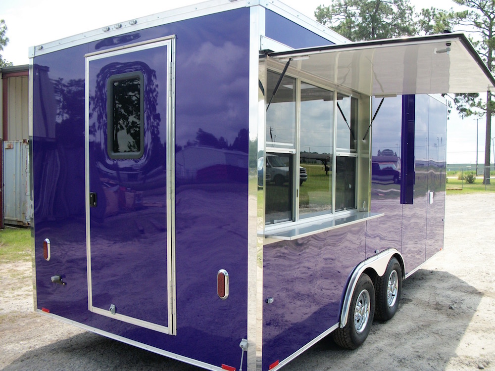 A purple trailer with a window open and a door closed.